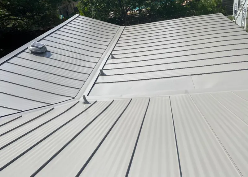 Solar attic fan installed on a metal roof for Roof Ventilation in La Crosse